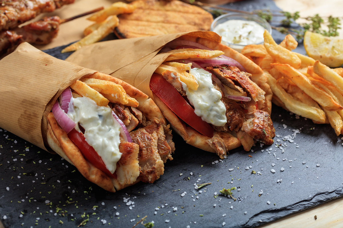 Gyros in pita sliced with an electric gyro knife